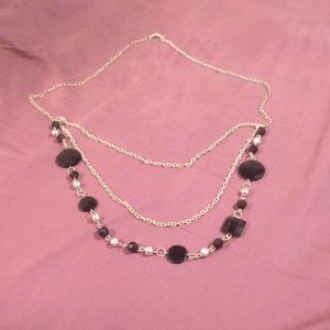 Silver chain necklace with black accessories